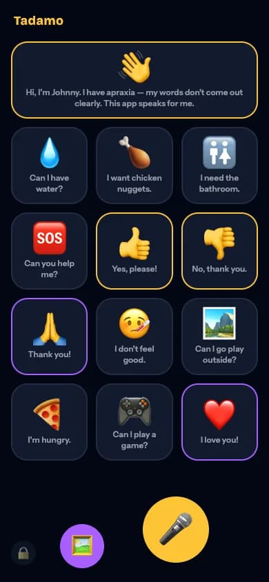 The Tadamo talking board: a grid of emoji phrase tiles like 'Can I have water?', 'I'm hungry.' and 'I love you!', and a large golden microphone button.